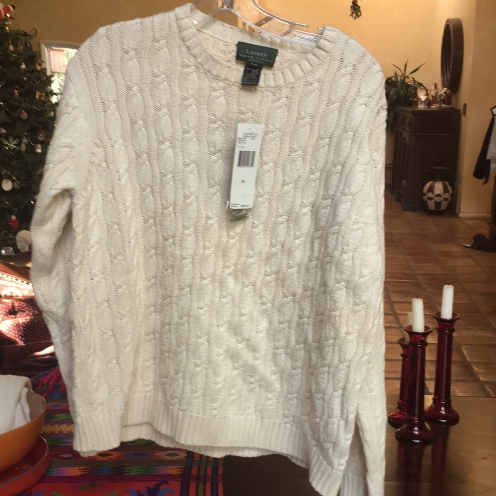 Lauren Ralph Lauren cableknit cotton sweater with crew neck and long sleeves.
